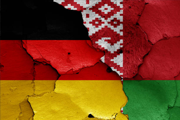 istock flags of Germany and Belarus painted on cracked wall 1182023329