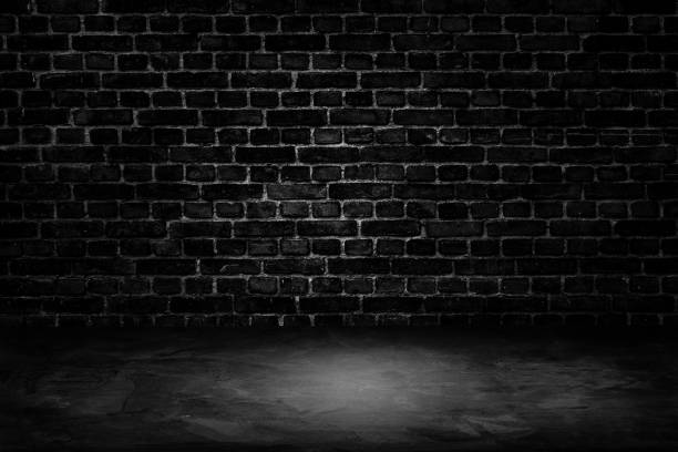 istock Architecture dark room black brick wall with concrete floor. 1182024133