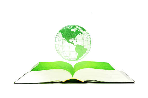 istock Green planet earth globe floating over opened book isolated on white background. 1182024188