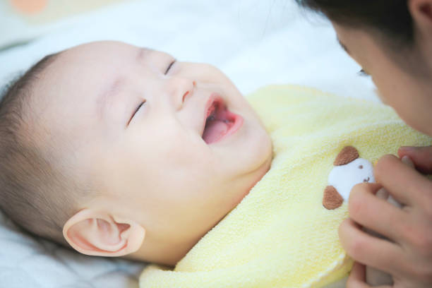 istock Cute baby lying on bed 1182031510