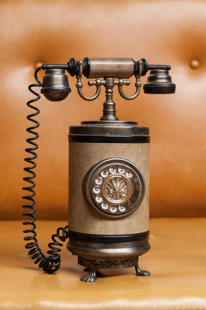 istock Collection piece - old telephone with cable and disk to dial telephone numbers 1182043564