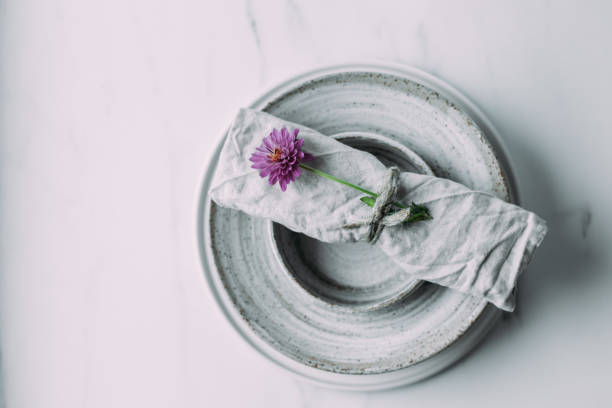 istock grey bowls and plates on a white marble table . scandinavian ceramic vintage handmade dishes. Flat lay 1182043890