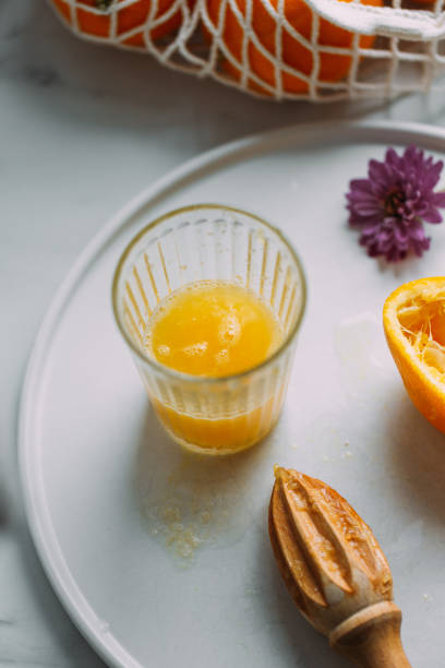 istock Fresh Orange Juice Squeezed In glass 1182044999