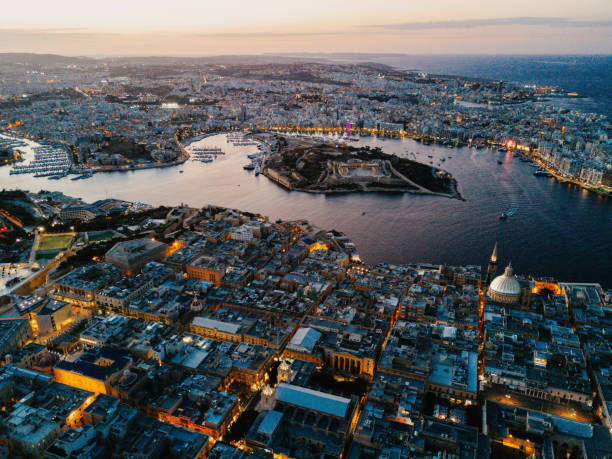 istock Malta - Mediterranean travel destination - night falling over Valetta 1182047511