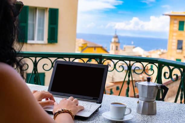 istock Hands typing on keyboard of a laptop with blank screen. 1182048978
