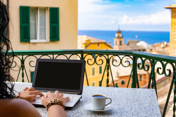 istock Hands typing on keyboard of a laptop with blank screen. 1182049284