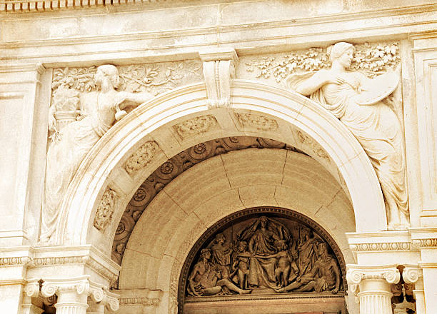 stone facade on classical building with ornaments and sculptures