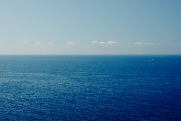 istock Boat on blue sea surface aerial view. Nature background 1182051040