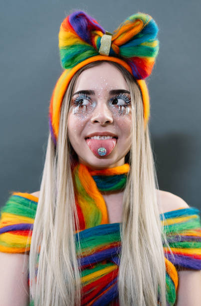 istock Young Woman Looking Away While Sticking Out Tongue 1182051473