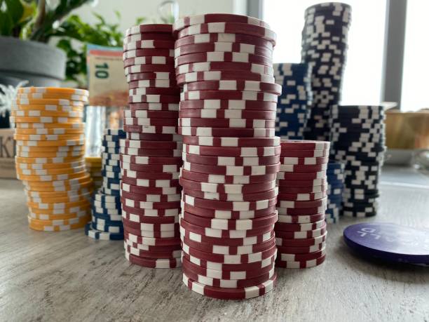 istock Close up of gambling chips on table 1182052893