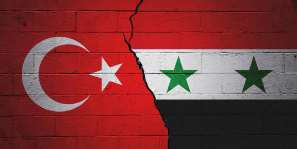 Turkey vs Syria Cracked brick wall painted with a Turkish flag on the left and a Syrian flag on the right. syria stock pictures, royalty-free photos & images