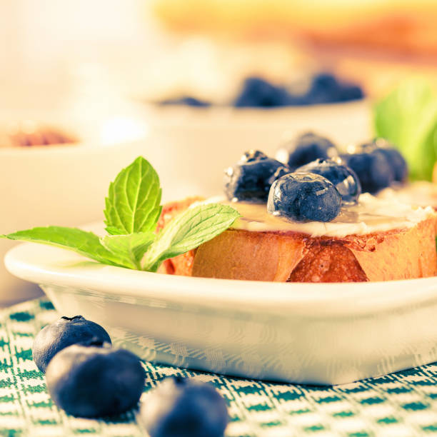 breakfast set with ricotta, blueberries and honey sandwiches