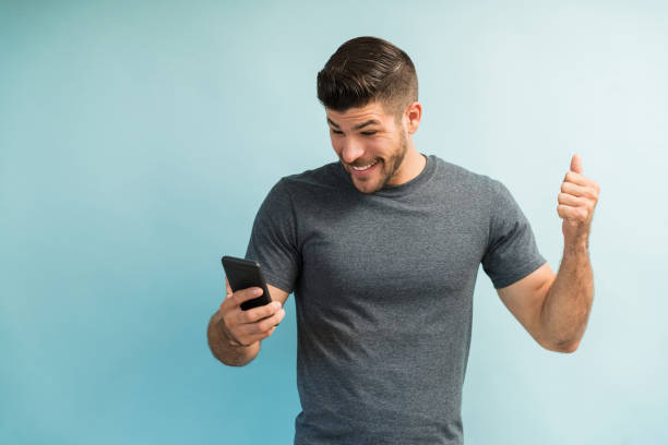 istock Good Looking Male Millennial Looking At Mobile Phone 1182053849