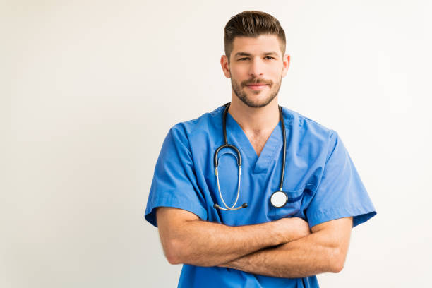 istock Portrait Of Young Surgeon Isolated Against Plain Background 1182053907