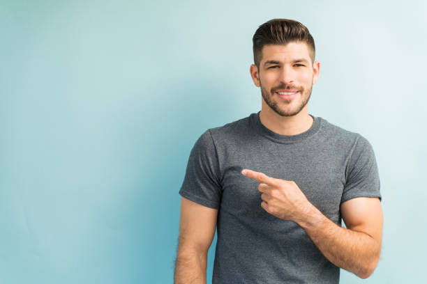 istock Attractive Male Is Gesturing In Studio 1182054789