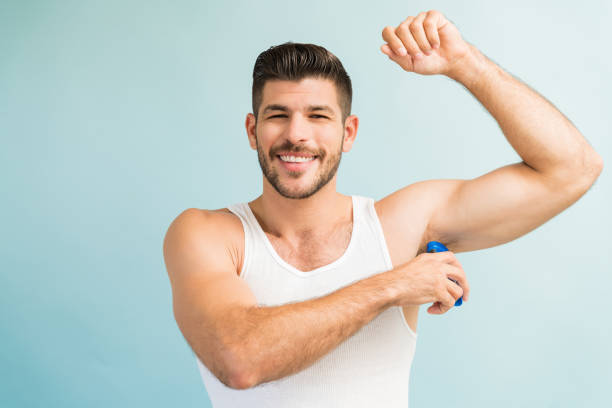 istock Smiling Male With Antiperspirant In Studio 1182054958