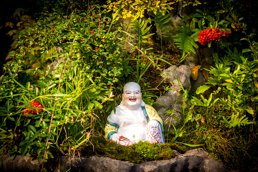 Clay doll of Buddhist novice holding sitting for meditation, Phuket,Thailand
