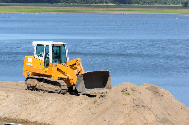 istock Grader on a Construction Site of river dam 118205903