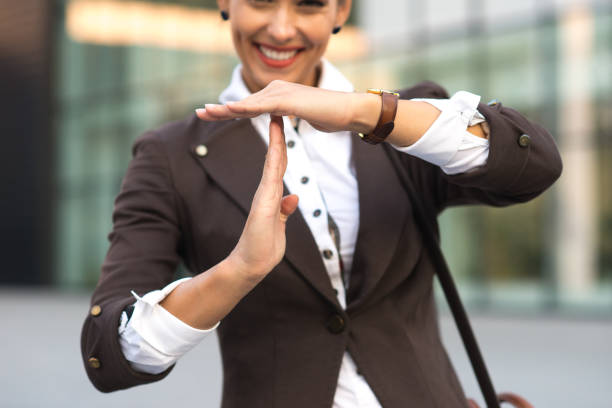 Businesswoman going home from work Beautiful young businesswoman going home from work. time out signal stock pictures, royalty-free photos & images