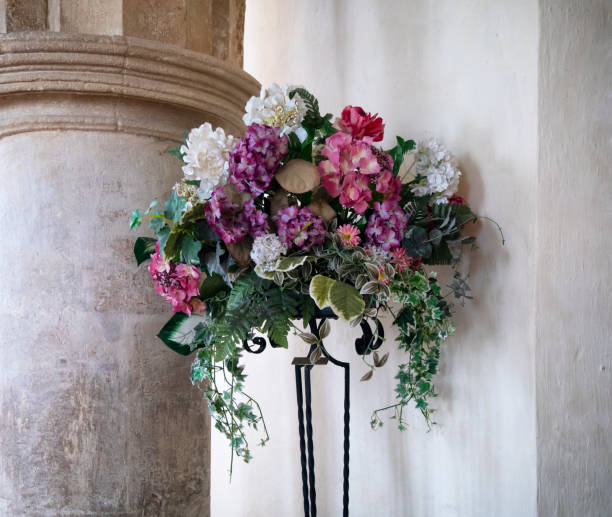 istock Artificial flower arrangement in a parish church 1182060831