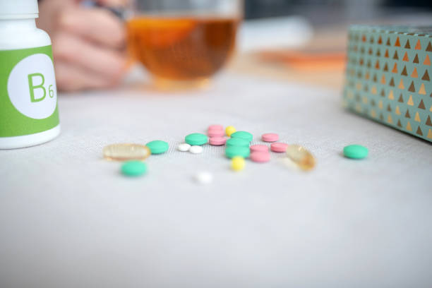istock Close up of various vitamins and pills lying on the table 1182061374