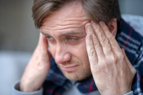 istock Blue-eyed bearded man feeling terrible while having headache 1182062306