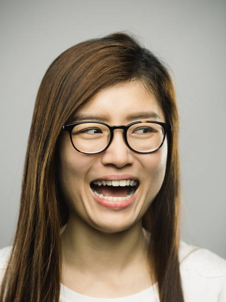 istock Real chinese young woman with excited expression looking to the side 1182062985