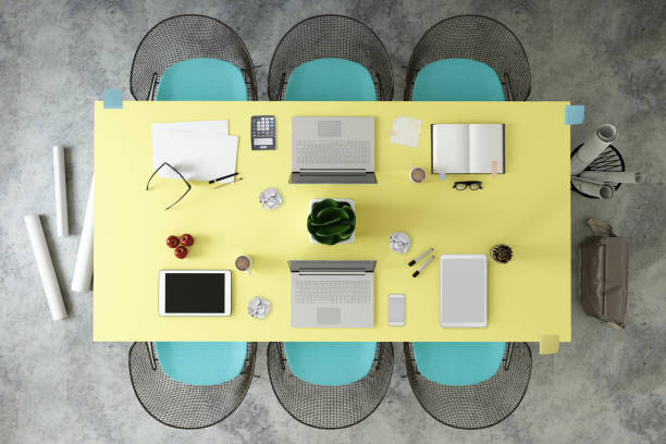 istock Top view at large team office desk 1182063794