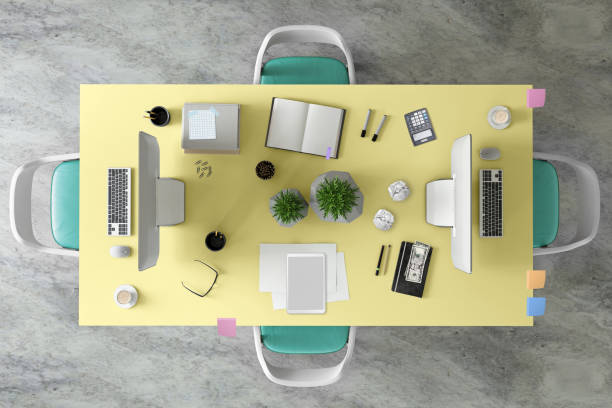 istock Top view at large team office desk 1182063811