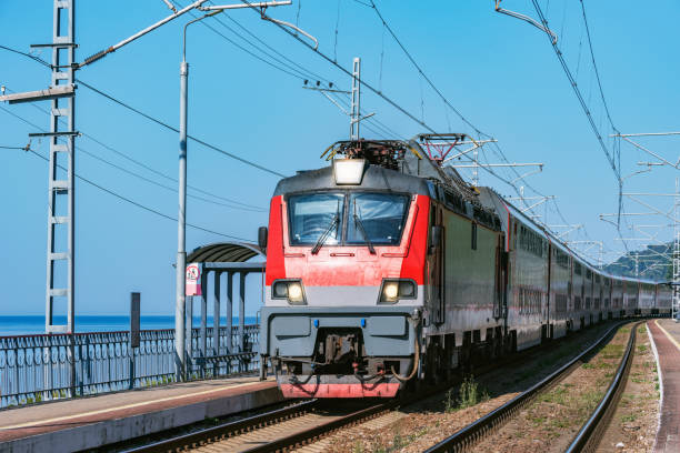 istock Passenger double deck train moves along the platform by the Black sea coast. 1182066104
