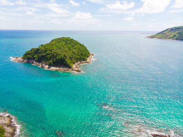 istock Sea island with turquoise water against blue sky 1182067551