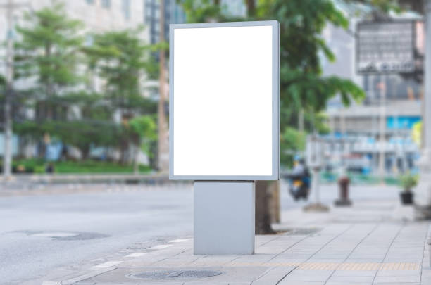 istock led blank billboard white screen side road in city. ad mockup copy space for advertising banner near bus stop in metropolis. 1182072094