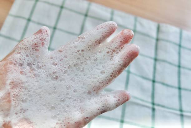 istock Close Up Woman Hand with Bubble Foam 1182073243