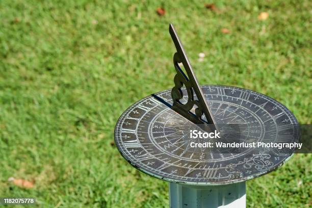 Vintage Metal Sundial In A Park Stock Photo - Download Image Now - Sundial, Clock, Sun