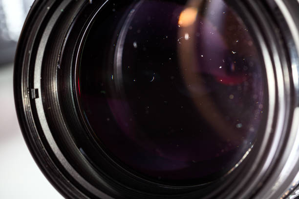 istock Dust particles inside camera lens closeup shot with selective focus and blur. 1182075784