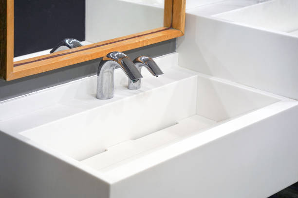 istock Modern white bathroom sink with faucet 1182077078