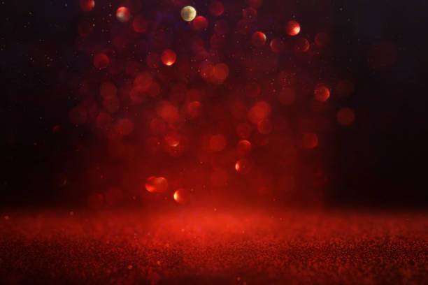istock background of abstract red and gold glitter lights. defocused 1182077218