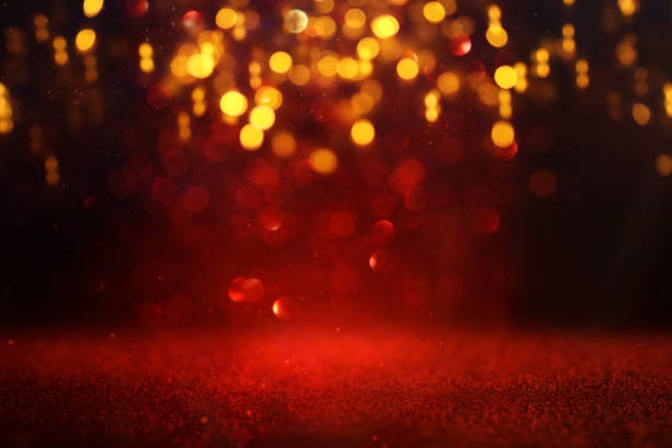 istock background of abstract red and gold glitter lights. defocused 1182078246