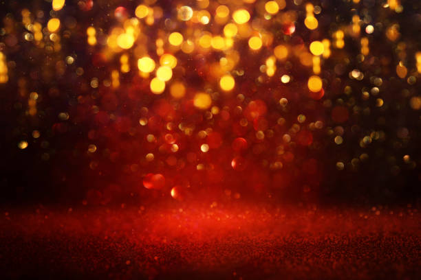 istock background of abstract red and gold glitter lights. defocused 1182078352