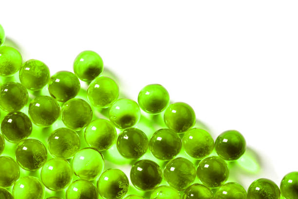 istock ufo green spherical ball capsules with selective focus isolated on white background 1182081690