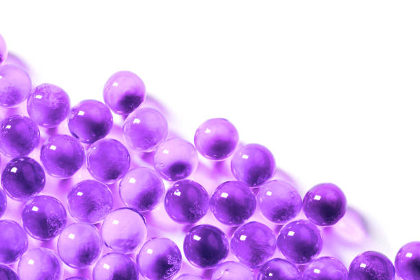 istock proton purple spherical ball capsules with selective focus isolated on white background 1182081707
