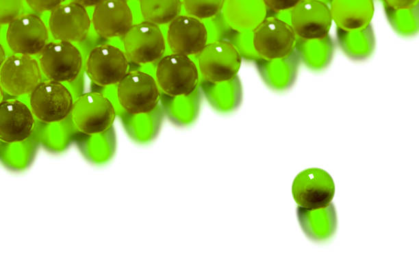 istock ufo green spherical ball capsules with selective focus isolated on white background 1182081756