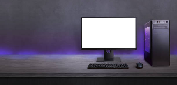 istock Gaming computer on desk with isolated screen for mockup. Free space beside for promo text. Modern computer with RGB light. 1182084911