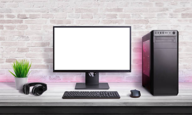 istock Gamer PC on desk with isolated screen for app, web site or game promotion. Modern case with RGB light, mouse, keyboard and headphones. 1182084920