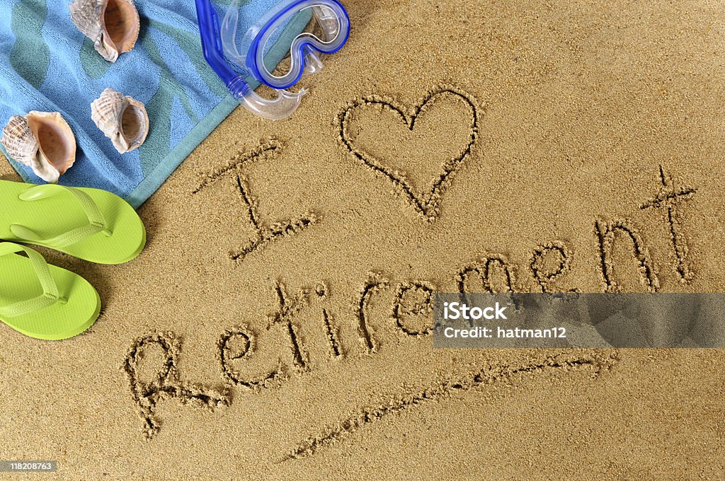 Retirement beach writing Beach background with towel and flip flops and the words I Love Retirement written in sand (studio shot - directional light and warm color are intentional).  To see my complete collection of beach scenes please CLICK HERE.  Alternative file shown below: 401k - Single Word Stock Photo
