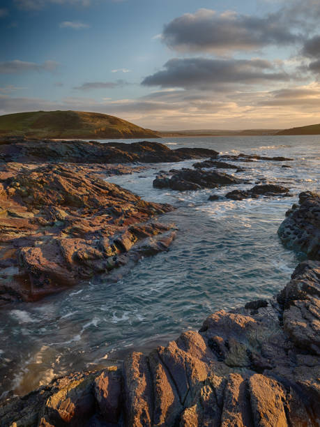 istock The rocks around Daymer illuminated by the setting sun 1182088207