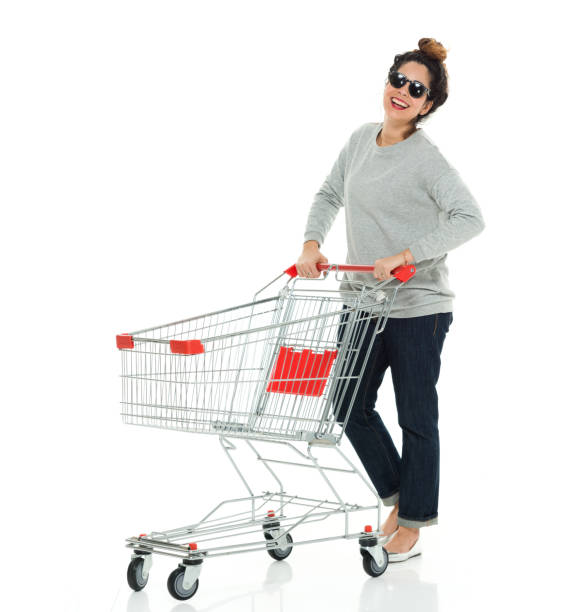 Full length / one person of 30-39 years old adult beautiful puerto rican ethnicity / latin american and hispanic ethnicity female / young women / one young woman only standing in front of white background wearing sweater / jeans / sunglasses Full length / one person of 30-39 years old adult beautiful puerto rican ethnicity / latin american and hispanic ethnicity female / young women / one young woman only standing in front of white background wearing sweater / jeans / sunglasses who is smiling / happy / cheerful / cool attitude who is shopping and holding shopping cart cool shopping cart stock pictures, royalty-free photos & images