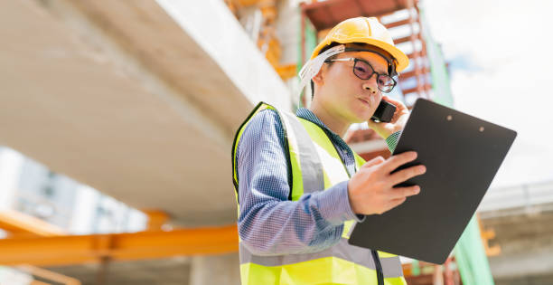 istock smart asian glasses engineer use radio connection working in site construction 1182091429