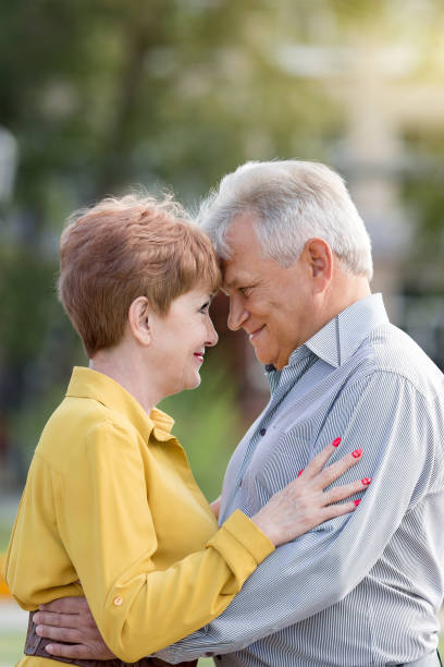istock Elderly married couple outdoors. Outdoors in the park 1182092198