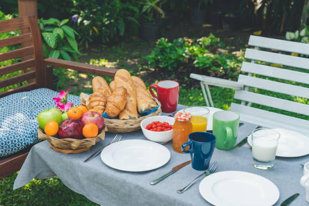 istock Breakfast table with food in the garden 1182093477